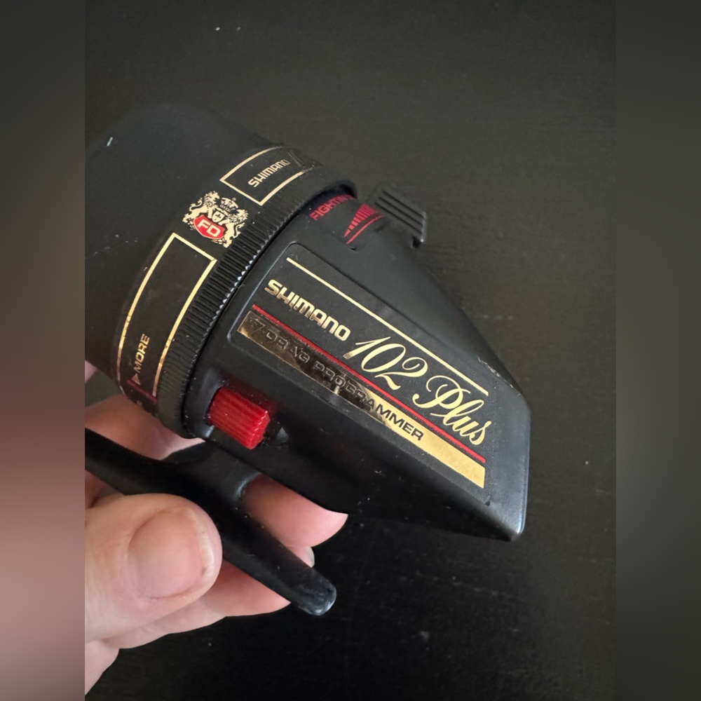 Shimano Spinning Reel in Black with Gold & Red Accents